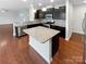 Modern kitchen featuring granite countertops, stainless steel appliances, and dark cabinetry at 133 Sequoia St, Mooresville, NC 28117