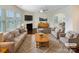 Bright living room with fireplace, modern furnishings, and an open layout at 133 Sequoia St, Mooresville, NC 28117