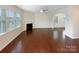 Spacious living room with hardwood floors, natural light, and a fireplace at 133 Sequoia St, Mooresville, NC 28117