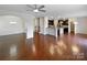 Open concept living room with hardwood floors flowing into the kitchen and dining room at 133 Sequoia St, Mooresville, NC 28117