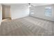 Large main bedroom with carpet, natural light, and a ceiling fan at 133 Sequoia St, Mooresville, NC 28117