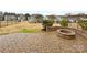 Brick patio featuring a fire pit and a view of the grassy area and neighboring homes at 133 Sequoia St, Mooresville, NC 28117