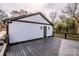 Side view of the house featuring a spacious deck with black railings and a door leading inside at 1331 14Th Ne St, Hickory, NC 28601