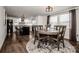 Open dining area with a round table, stylish chairs, and a view into the modern kitchen at 1331 14Th Ne St, Hickory, NC 28601