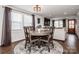 Well-lit dining area with a round table, seating for four, and a view of the living room at 1331 14Th Ne St, Hickory, NC 28601