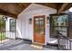 Attractive wood front door with glass inset, enhanced by decorative lighting and a cozy welcome mat at 1331 14Th Ne St, Hickory, NC 28601
