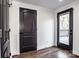 Hallway leading to a deck, hardwood floors, and stylish black doors at 1331 14Th Ne St, Hickory, NC 28601