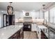 Bright kitchen features modern appliances, a farmhouse sink, and an island with a marble countertop at 1331 14Th Ne St, Hickory, NC 28601