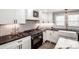 Modern farmhouse kitchen with white cabinetry, subway tile backsplash, and stainless steel appliances at 1331 14Th Ne St, Hickory, NC 28601