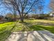 Backyard featuring a well-maintained lawn and lush greenery at 13424 Kibworth Ln, Charlotte, NC 28273