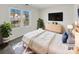 Bright bedroom featuring modern minimalist design, decor, neutral colors, and plenty of natural light at 13424 Kibworth Ln, Charlotte, NC 28273