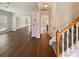Welcoming entryway with hardwood floors, staircase, and views into adjacent living spaces at 13424 Kibworth Ln, Charlotte, NC 28273