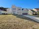 Charming two-story home with a well-manicured lawn and attached two-car garage at 13424 Kibworth Ln, Charlotte, NC 28273