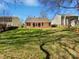 Large backyard with a grassy lawn, wood fence and a patio area at 1419 Deer Forest Dr, Fort Mill, SC 29707