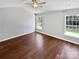 Clean, empty room with hardwood floors, ceiling fan and ample natural light at 1419 Deer Forest Dr, Fort Mill, SC 29707