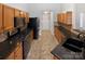 Traditional kitchen with dark countertops and ample cabinet storage at 1419 Deer Forest Dr, Fort Mill, SC 29707