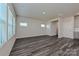 Spacious living area with gray floors, bright windows, and open access to the kitchen at 1421 31St Ne St, Conover, NC 28613