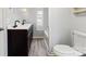 This bathroom features a double sink vanity with dark cabinets and black hardware with light gray walls at 144 Cherokee Ln, New London, NC 28127
