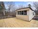 Spacious deck overlooking a private backyard, perfect for outdoor gatherings and relaxation at 144 Cherokee Ln, New London, NC 28127