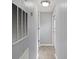 This hallway features light gray walls, wood flooring, and leads to various rooms, ensuring easy navigation at 144 Cherokee Ln, New London, NC 28127