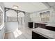 The kitchen opens up to the living room featuring modern floors and white and brown cabinets at 144 Cherokee Ln, New London, NC 28127