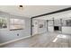 Bright living room with ample natural light and modern floors flowing into the kitchen at 144 Cherokee Ln, New London, NC 28127