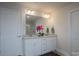 Bright bathroom features a double vanity with granite countertops, modern fixtures, and dual doors at 149 High Rock Ct # 02, Statesville, NC 28677