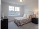 Cozy bedroom features a large window and neutral decor at 149 High Rock Ct # 02, Statesville, NC 28677
