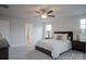 Comfortable bedroom featuring plush carpeting, a ceiling fan, soft natural light, and a cozy feel at 149 High Rock Ct # 02, Statesville, NC 28677