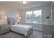 Bedroom boasts a large window and neutral decor at 149 High Rock Ct # 02, Statesville, NC 28677