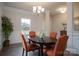 Elegant dining area featuring natural light, wainscoting, and stylish decor at 149 High Rock Ct # 02, Statesville, NC 28677