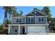 Charming two-story home featuring a covered entryway and a two-car garage at 149 High Rock Ct # 02, Statesville, NC 28677