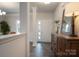 Welcoming home entrance with wood floors, natural light, and decorative elements at 149 High Rock Ct # 02, Statesville, NC 28677