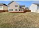 Large backyard with a wooden deck, green lawn, and a wooden fence at 15120 Callow Forest Dr, Charlotte, NC 28273