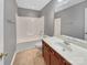 Bathroom featuring a sink vanity, toilet, and tub and shower combo with neutral gray walls at 15120 Callow Forest Dr, Charlotte, NC 28273