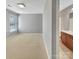 Carpeted bedroom featuring a neutral gray walls and natural light, connected to an ensuite bathroom at 15120 Callow Forest Dr, Charlotte, NC 28273