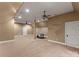 Large bonus room featuring carpeted floors, ceiling fans, and a drum set at 17429 Staysail Ct, Cornelius, NC 28031