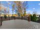 Spacious deck offers stunning views and plenty of room for outdoor entertaining with brick and metal railing at 17429 Staysail Ct, Cornelius, NC 28031