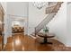 Grand foyer with a staircase and a view into the formal dining room at 17429 Staysail Ct, Cornelius, NC 28031