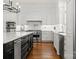 Well-appointed kitchen equipped with stainless steel appliances, custom cabinetry, and a functional layout for culinary enthusiasts at 17429 Staysail Ct, Cornelius, NC 28031