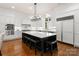 Bright kitchen features a spacious center island, stainless steel appliances, and ample counter space ideal for cooking at 17429 Staysail Ct, Cornelius, NC 28031