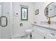 Bright bathroom featuring a modern vanity with marble countertop and glass-enclosed shower at 1817 Jameston Dr, Charlotte, NC 28209