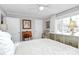 Cozy bedroom with a ceiling fan, bright windows, and neutral paint colors at 1817 Jameston Dr, Charlotte, NC 28209