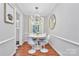 Cozy dining area with modern lighting and sleek furniture, ideal for intimate gatherings at 1817 Jameston Dr, Charlotte, NC 28209