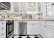 Well-lit kitchen with stainless steel appliances, modern cabinetry, and marble countertops at 1817 Jameston Dr, Charlotte, NC 28209