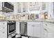 Well-lit kitchen with stainless steel appliances, modern cabinetry, and marble countertops at 1817 Jameston Dr, Charlotte, NC 28209