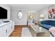 Elegant living room featuring hardwood floors, stylish furnishings, and abundant natural light and open floor plan at 1817 Jameston Dr, Charlotte, NC 28209