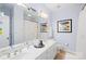 Bright bathroom with a large mirror and double vanity at 19118 Betty Stough Rd, Cornelius, NC 28031