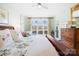 Light filled main bedroom boasts large windows and decorative touches throughout at 19118 Betty Stough Rd, Cornelius, NC 28031