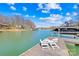 Dock featuring a boat lift and chairs perfect for lakeside relaxation at 19118 Betty Stough Rd, Cornelius, NC 28031